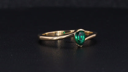 Emerald pear cut engagement ring